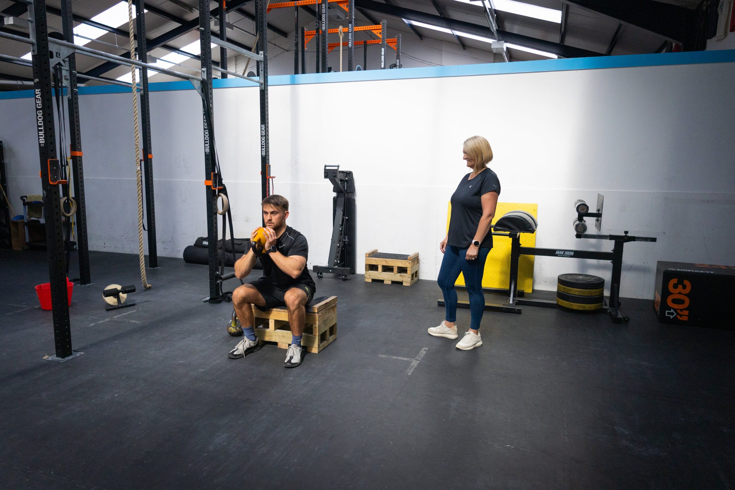 finding-your-edge-box-squat adam and sam holding kettlebell