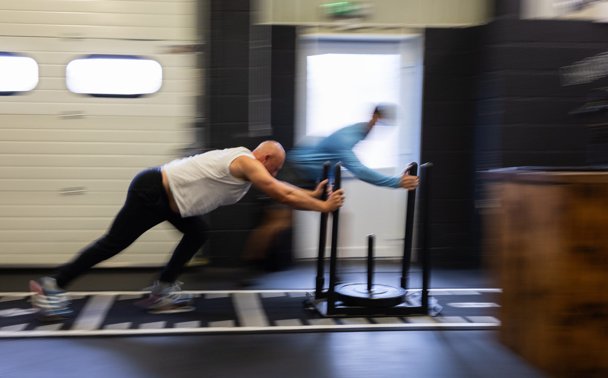 rob pushing weight blurred