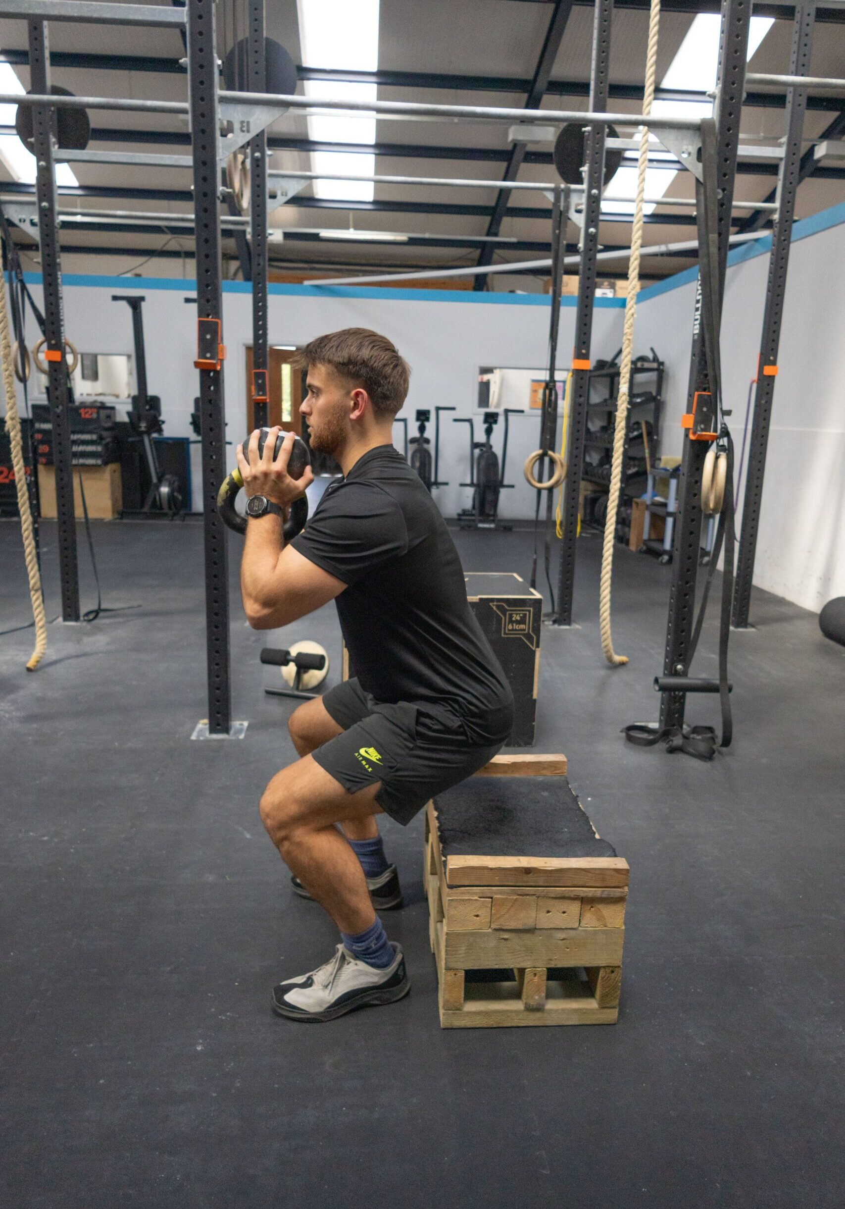 finding-your-feet-text-image adam side holding kettlebell squat